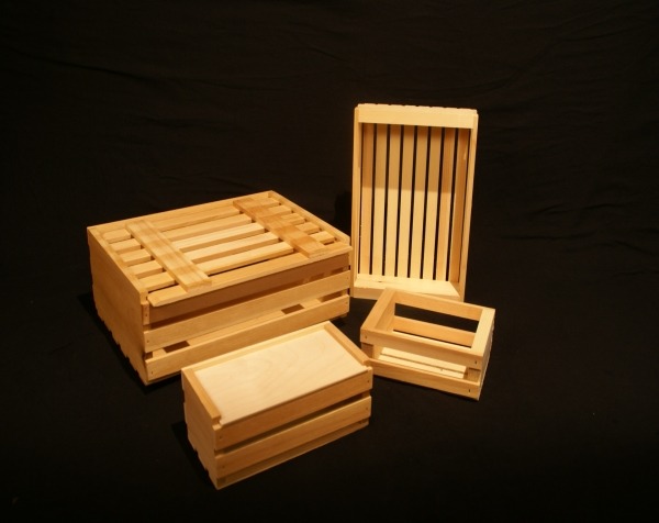 Custom slatted wooden crates with sliding tops, available in bulk for packaging, storage, and product display.